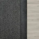 Black-textured-patio-rug-with-canvas-binding
