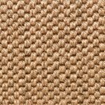 Close-up of a golden-brown woven sisal rug texture.