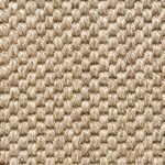 Close-up of a light beige or sandy colored woven rug.