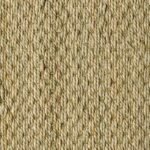 Close-up of a natural fiber rug featuring a vertical ribbed weave pattern.