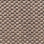 Close-up of a rustic brown woven jute rug texture.