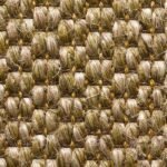 Close-up top view of a natural woven seagrass or jute carpet showing a chunky basketweave pattern in golden-brown and tan tones.