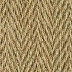 Detailed texture of a seagrass rug with a diagonal herringbone weave.
