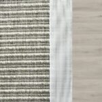 Grey striped outdoor rug with white border.