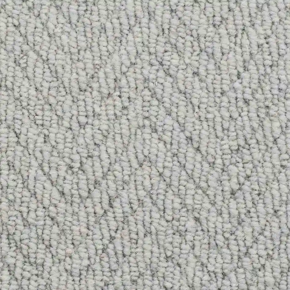 Light grey wool loop pile carpet with soft irregular pattern