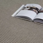 grey-ribbed-carpet-with-an-open-magazine-lying-on-top