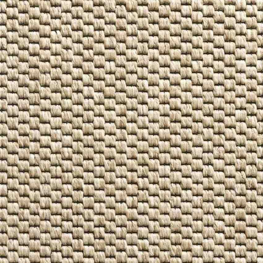 Close-up of ivory woven area rug with textured natural fiber pattern