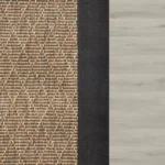 patterned-rug-with-a-thick-black-border-on-a-light-wood-floor.