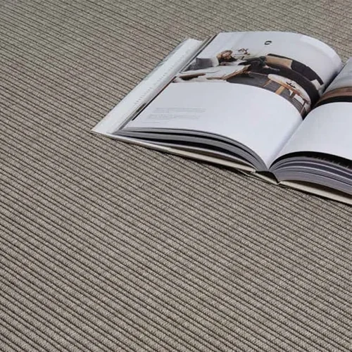 grey-ribbed-carpet-with-an-open-magazine-lying-on-top