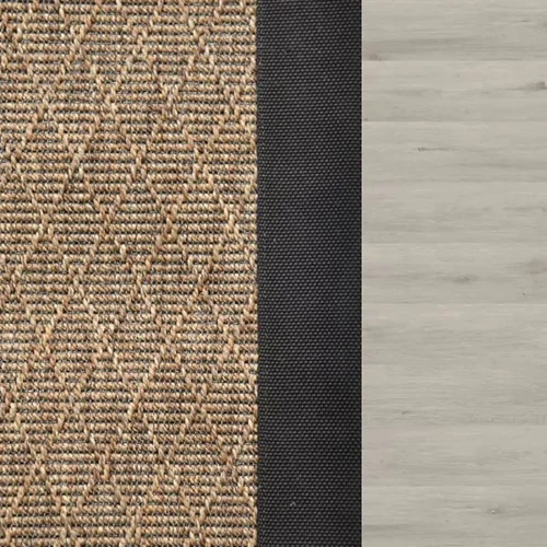 sisal-rug-with-a-diamond-weave-pattern-and-a-thick-black-fabric-border-on-a-light-wood-floor